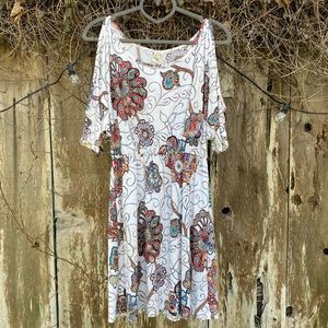 Peek-a-boo shoulder dress with flowy sleeves.